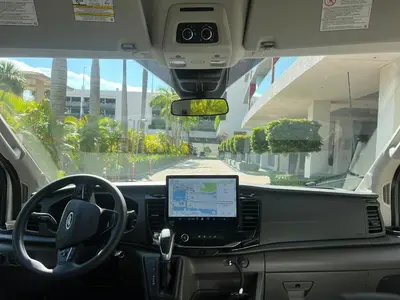 a view from the inside of a bus with a laptop on the dashboard at Studio with Service Beach and Pool Hallandale Beach in Hallandale Beach
