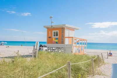 a small building on the beach near the ocean at Amazing Studio at Hallandale Beach with service beach in Hallandale Beach