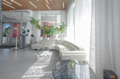 a living room with a couch and a table at Amazing Studio at Hallandale Beach with service beach in Hallandale Beach