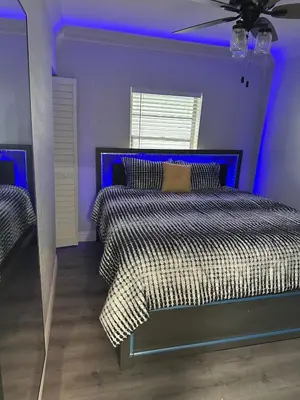 a purple bedroom with a bed with a blue ceiling at Luxury Entertainment home Hard rock stadium in Opa-locka
