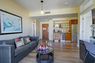 a living room with a couch and a table at Amazing 1 Bedroom with Rooftop Pool D309 in Miami Beach