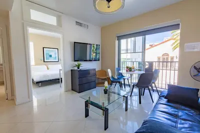 a living room with a couch and a table at Beautiful 1 bedroom with Rooftop Pool D209 in Miami Beach