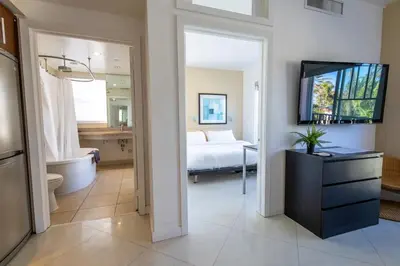 a room with a bedroom with a bed and a bathroom at Beautiful 1 bedroom with Rooftop Pool D209 in Miami Beach