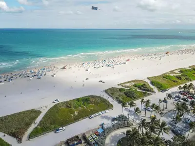 an aerial view of a beach with a lot of people at Beautiful 1 Bedroom with Rooftop Pool D203 in Miami Beach