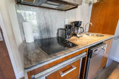 a kitchen counter with a coffee maker and a sink at Beautiful 1 Bedroom with Rooftop Pool D203 in Miami Beach