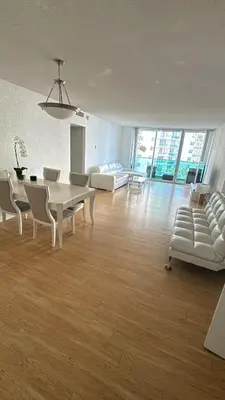 a large living room with a table and chairs at beautiful place 1 in Hollywood