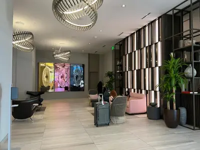 a lobby with chairs and tables in a building at Best Apartment next to Hollywood Beach 2B 2B in Hollywood
