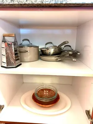 two pots and pans on a shelf in a refrigerator at 1BR Brickell included Pool, Gym and Free Parking in Miami