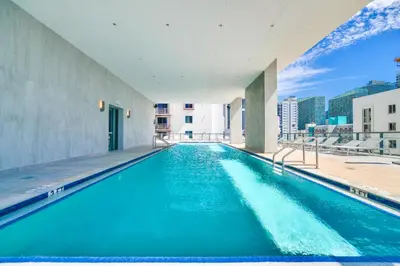 a swimming pool on the roof of a building at Central Brickell Condo Walk to Shops & Dining in Miami