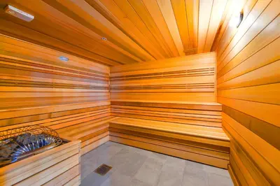 a sauna with wood paneled walls and a wooden ceiling at Central Brickell Condo Walk to Shops & Dining in Miami