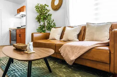 a living room with a brown couch and a table at Miami 3BR Cruise Port Calle 8 Brickell South Beach in Miami