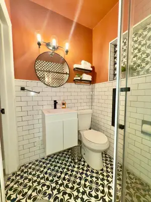 an orange bathroom with a toilet and a sink at Miami 3BR Cruise Port Calle 8 Brickell South Beach in Miami