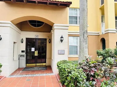 a front door of a building with a building at Yacht Club Aventura 2 BR 2 Bath with Free Parking in Aventura