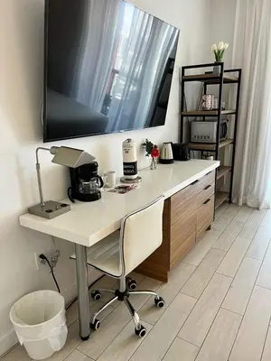 a desk with a television on top of it at Studio Apmt 2 Beds with pool and gym in Hallandale Beach