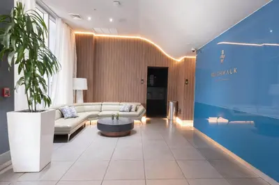 a living room with a couch and a table at Studio Apmt 2 Beds with pool and gym in Hallandale Beach