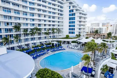 an overhead view of a swimming pool in front of a building at Beachfront Ritz-Carlton Luxury 1BR Residence in Fort Lauderdale