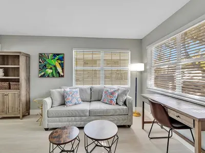 a living room with a couch and a table at North Hollywood Beach 1BR | Walk to Ocean in Dania Beach