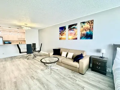a living room with a couch and a table at Ocean Reserve Luxury Condo Sunny Isles Beach in Sunny Isles Beach