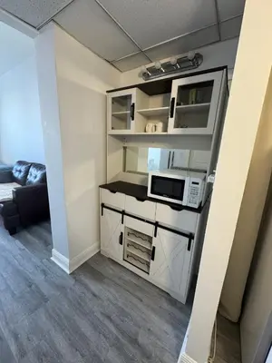 a small room with a kitchen with a microwave at Ocean Reserve Luxury Condo Sunny Isles Beach in Sunny Isles Beach