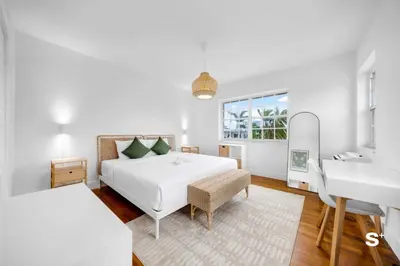 a white bedroom with a bed and a sink at Modern 1-BD Apt with Free Parking in Miami Beach