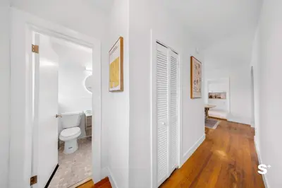 a bathroom with white walls and a toilet at Modern 1-BD Apt with Free Parking in Miami Beach