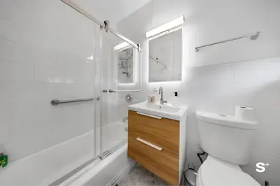 a bathroom with a shower and a toilet and a sink at Modern 1-BD Apt with Free Parking in Miami Beach