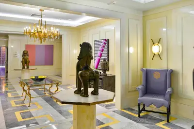 a lobby with a statue on a table and a chair at Luxury Miami Condo with Breathtaking City & Bay Views in Miami