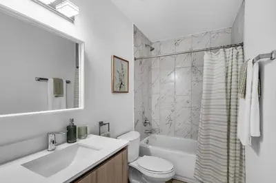 a bathroom with a sink and a toilet and a tub at #208 Brand New 2BR -2BA near marlins stadium in Miami