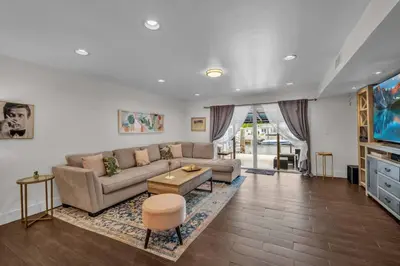a living room with a couch and a table at Vista Mar Scenic 3BR Family Waterfront w Private Dock in North Miami