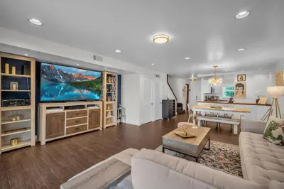 a living room with a large flat screen tv at Vista Mar Scenic 3BR Family Waterfront w Private Dock in North Miami