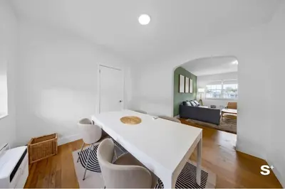 a white dining room with a white table and chairs at Modern 1-BD Beachside Apt with Free Parking in Miami Beach