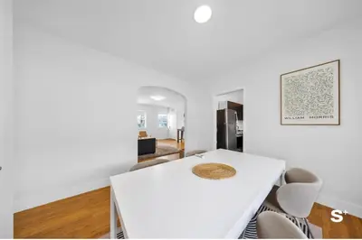 a white dining room with a white table and chairs at Modern 1-BD Beachside Apt with Free Parking in Miami Beach