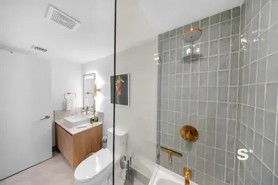 a bathroom with a toilet and a sink and a shower at 2-BD Downtown Miami Condo with City Views in Miami