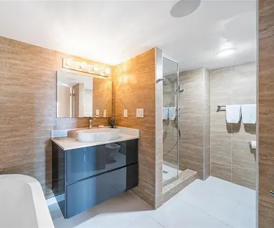 a bathroom with a sink and a shower at Luxury 3-Bedroom Bayview Retreat at The Grand Miami in Miami