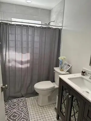 a bathroom with a toilet and a sink at Peach Private Room in Miami