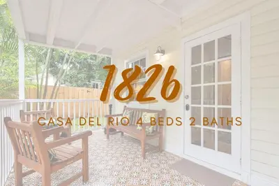 a porch with a door with a sign on it at 3 Home 12 bedroom compound with Pool and BBQ sleeps 24 in Miami