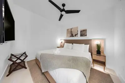 a bedroom with a bed and a ceiling fan at 1-BD Condo in DTW Miami - City Views in Miami
