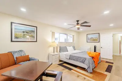 a bedroom with a bed and a couch at Luxury Retreat Near Hard Rock in Joe Robbie Stadium Heliport