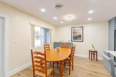 a dining room with a table and chairs at Luxury Retreat Near Hard Rock in Joe Robbie Stadium Heliport