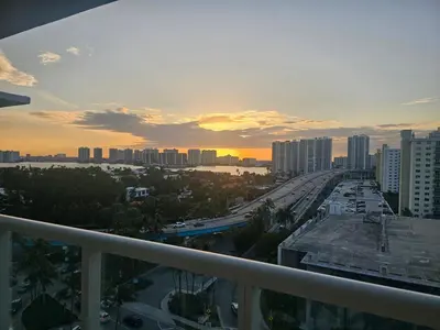 a view of a city from the balcony of a building at Beach Studio with City View in Sunny Isles Beach
