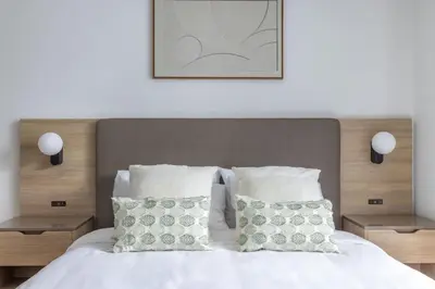 a bedroom with a white bed with two pillows at 3701 Kaseya Center 2 Bdr Apt with Pool and Gym in Miami