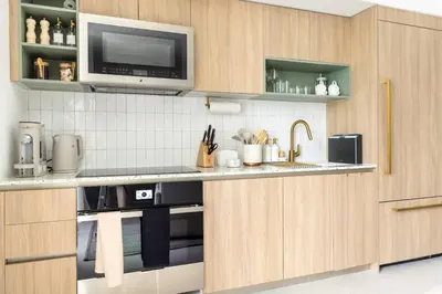a kitchen with a sink and a microwave at 3701 Kaseya Center 2 Bdr Apt with Pool and Gym in Miami