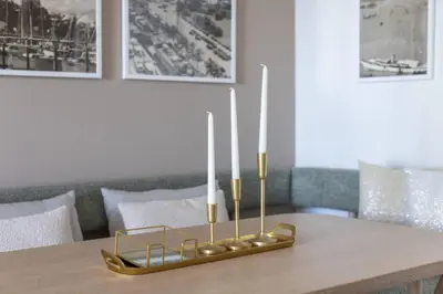 a dining room table with a gold candle holder at 3209 Apt in Heart of Downtown with Pool a Gym and Spa in Miami