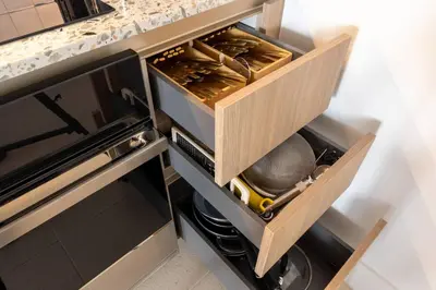 a kitchen with an open drawer with utensils at 3615 Luxury Condo for 8 people with Gym and Pool in front of Kaseya Center in Miami
