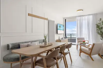 a living room with a table and a couch at 3615 Luxury Condo for 8 people with Gym and Pool in front of Kaseya Center in Miami