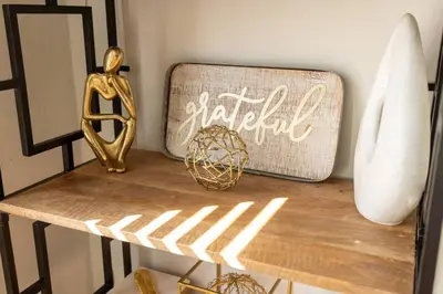 a table with a gold statue and a sign on it at Wynwood beautiful Art Deco home with 4 Bedroom in Miami