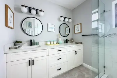 a white bathroom with a sink and a shower at Wynwood beautiful Art Deco home with 4 Bedroom in Miami