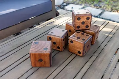 a group of wooden dice sitting on top of a table at Wynwood beautiful Art Deco home with 4 Bedroom in Miami
