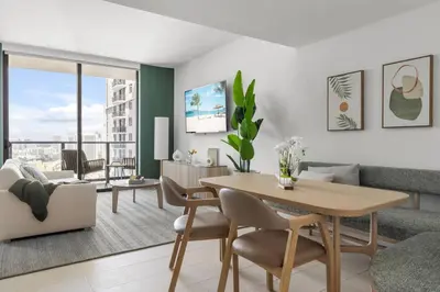 a living room with a table and a couch at 3013 Kaseya Center Apt for 4 people with Pool and Gym in Miami