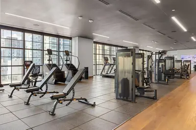 a gym with treadmills and ellipticals in a building at 3013 Kaseya Center Apt for 4 people with Pool and Gym in Miami